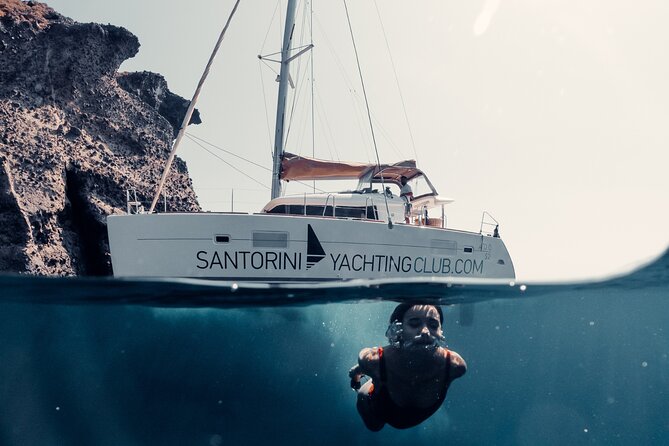 Beautiful Day Catamaran Caldera Cruise incl. Meal & Drinks - From Ammoudi to the Caldera Rim: How the Day Starts