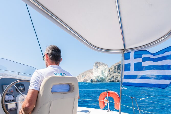 Best of Santorini Private Half-Day Catamaran Cruise with transfer and meal - Sailing past the old lighthouse and Black Rock: photo moments that don’t feel rushed