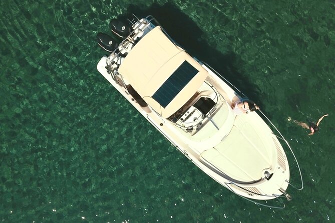 Explore Santorini and its volcanic wonders with Alex Private Boat - Stop 1: Nea Kameni hot springs, warm water and sulfur tips