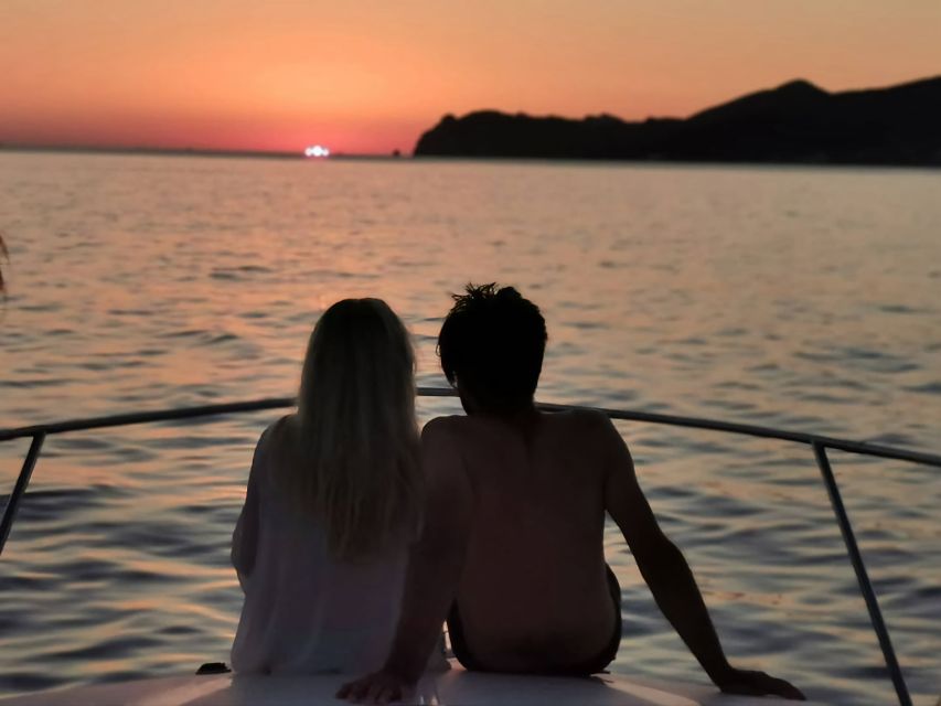 Fira: Private Sunset Cruise with BBQ, Drinks and Hot Springs - Passing Akrotiri: Indian Rock and the lighthouse views from the sea