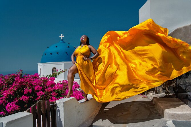 Flying Dress Photoshoot in Oia Private entry to Blue Dome - Flying dress details, assistant help, and getting the wind right