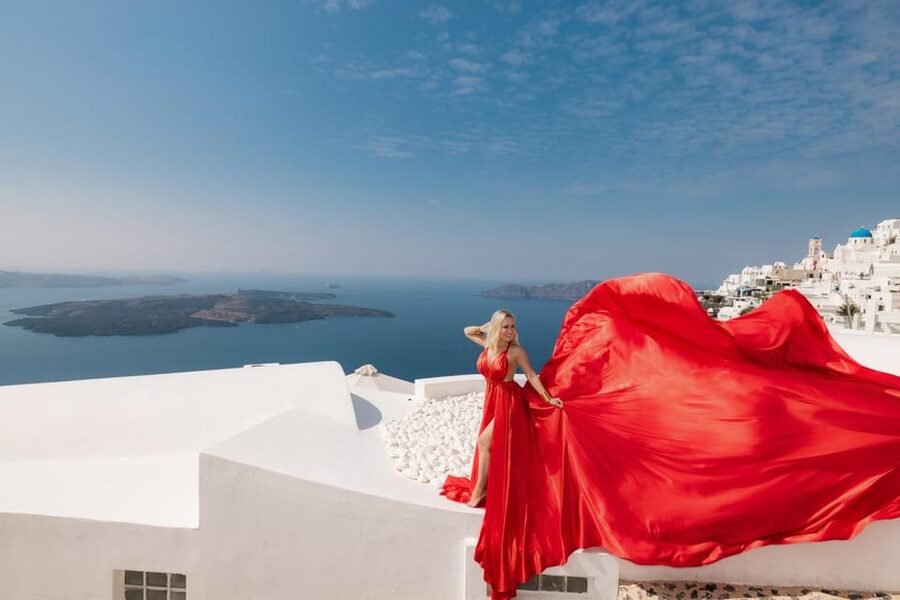 Flying dress Photoshoot in Santorini with Hotel Pickup - The Imerovigli Backdrop: Blue Domes, Churches, and Caldera Light