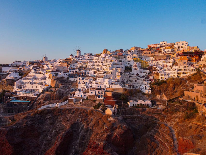 From Fira: Santorini Highlights Minibus Tour with Oia Sunset - Perissa Beach free time: black-sand calm and an easy meal plan