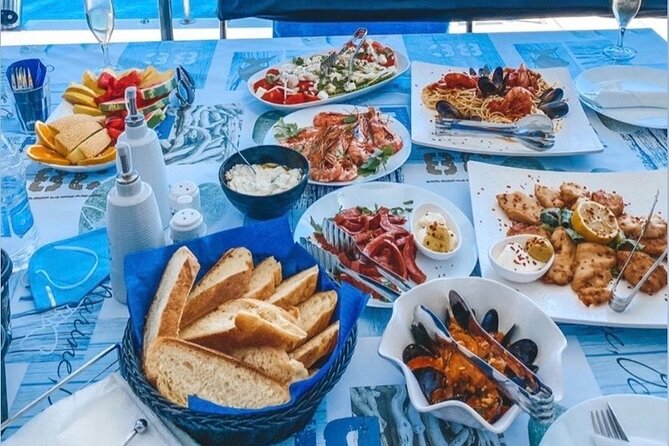 Half-Day Exclusive Catamaran Cruise in Santorini with Meal and Open Bar - The Santorini volcano and hot springs swim: what to expect from that warm water