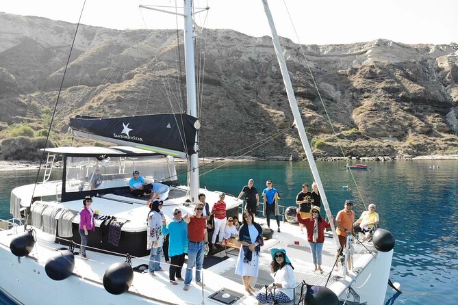 Half-Day Exclusive Catamaran Cruise in Santorini with Meal and Open Bar - Thirassia Island snorkeling and onboard BBQ: the meal is the second main event