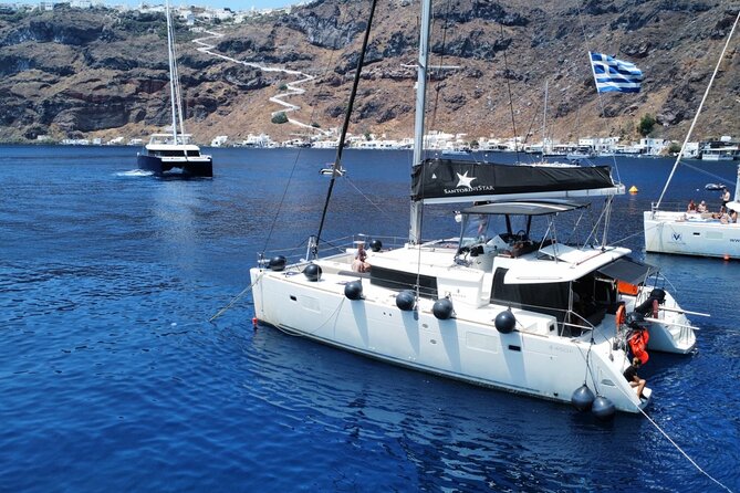 Half Day Premium Catamaran Cruise in Santorini including Oia - Oia and the Ammoudi Bay connection, plus the Venetian lighthouse angle