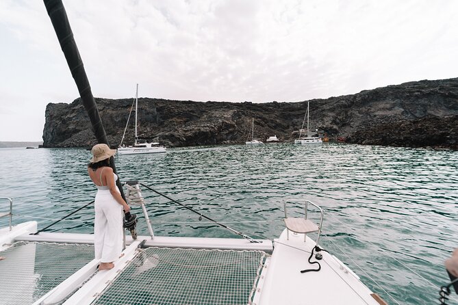 Half-Day Tailor-made Private Catamaran Cruise in Santorini - Limestone formations and crystal-clear water: the calm in between