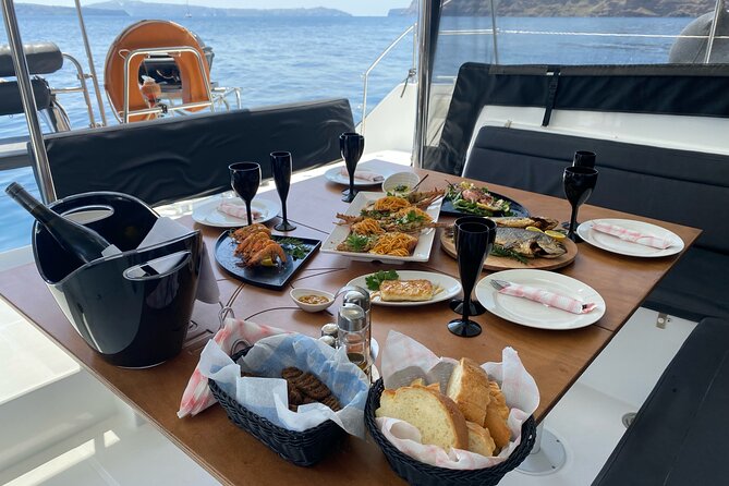 Half-Day Tailor-made Private Catamaran Cruise in Santorini - Passing Akrotiri’s lighthouse and the old harbor from the water