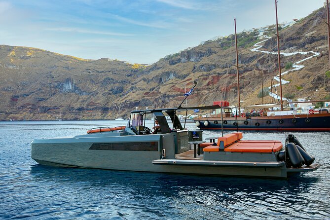 Luxury Private Power Catamaran Tour in Santorini - Lighthouse and Indian Rock: a strong photo stop without the foot traffic