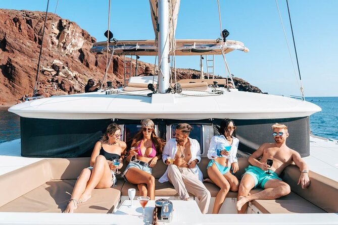 Luxury Santorini Catamaran Cruise: Lunch, BBQ, Drinks, Transfers - Getting on board at Vlychada Marina with roundtrip transfers