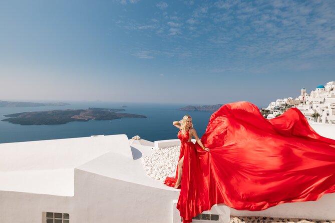 Premium Flying Dress Experience with Hotel Pick up & drop off - Blue Dome Imerovigli: the iconic stop that shapes the whole photo look
