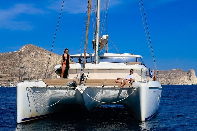 Private All Inclusive Day Cruise with Full Greek Lunch - White Beach, Akrotiri Lighthouse, and caldera views from sea level