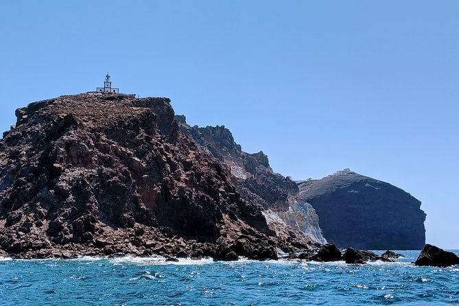 Private Full-Day Motor Yacht Cruise with Meal, Open Bar+Transfers - Akrotiri Lighthouse, Indian Rocks, and the Caldera View Pass