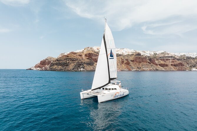 Private Morning Tour Lagoon 400-380 Sailing in Santorini ,lunch, drink, transfer - Board meeting points at Amoudi: where your morning catamaran day starts