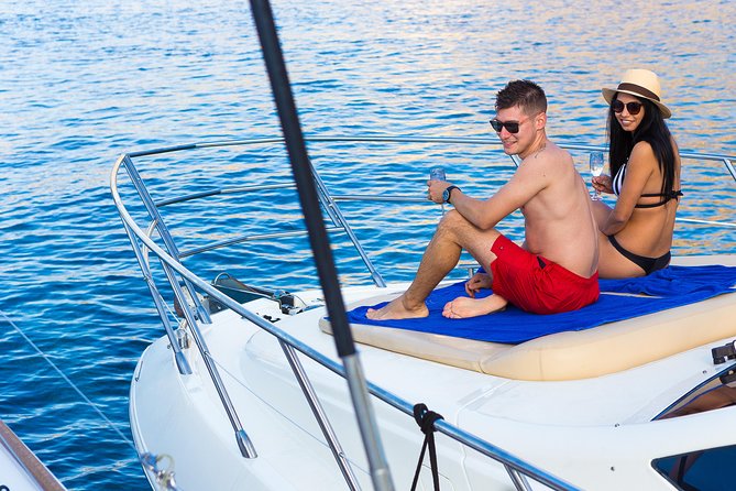 Private Motor Yacht Cruise with BBQ, Open Bar & Transfers - Caldera coast views, caves, and the Venetian Lighthouse moment