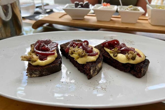 Private Santorini Wine Tour with 12 Wine Tastings and Dinner - Anhydrous Winery at Santo Wines: Volcanic Vineyard Walk, Family Cellar, and Foot-Crushed Grapes