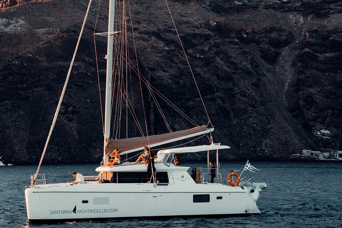 Romantic Sunset Catamaran Caldera Cruise incl. Meal & Drinks - Caldera views and beach stops: what you actually get at Red and White Beach
