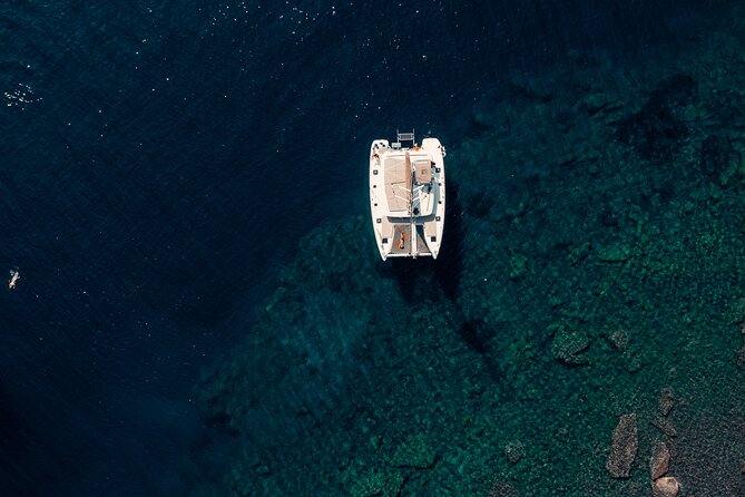 Romantic Sunset Catamaran Caldera Cruise incl. Meal & Drinks - The BBQ dinner at White Beach area: Greek starters first, then your main