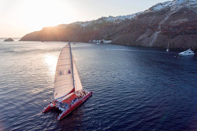 Sailing Catamaran Cruise in Santorini with BBQ, Drinks and Transfer - Red Beach swim and snorkeling: gorgeous color, short time