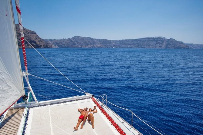 Sailing Catamaran Cruise in Santorini with BBQ, Drinks and Transfer - White Beach BBQ lunch: where the meal actually becomes the highlight
