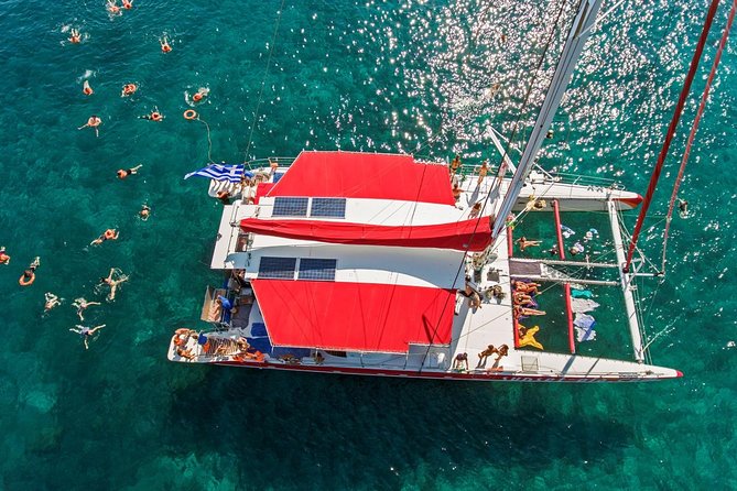 Sailing Catamaran Cruise in Santorini with BBQ, Drinks and Transfer - Sailing the caldera: volcano views and what you’re actually doing