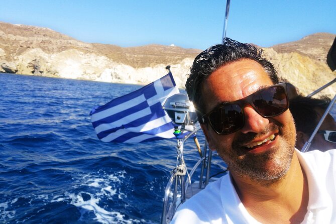 Sailsational Luxury Santorini Catamaran Sunset Cruise with Dinner - Stop 1: Red Beach and Volcanic Color Up Close