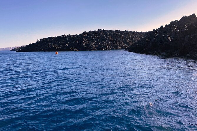 Sailsational Luxury Santorini Catamaran Sunset Cruise with Dinner - Stop 3: Santorini Volcano and Hot Springs Time