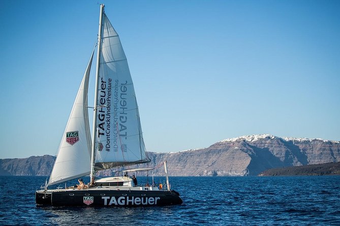 Santorini: Adventurous Catamaran Experience with Snorkeling - White Beach and the sea-color contrast