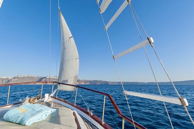 Santorini Caldera Day Traditional Cruise with Meal and Drinks - Amoudi Bay finish near Oia: sunset setup with one practical caution