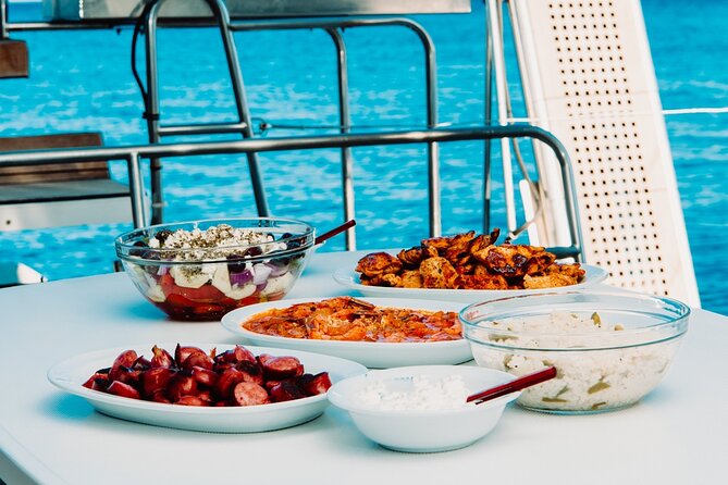 Santorini Caldera Gold Day Cruise with BBQ on board and Open Bar - Akrotiri’s Venetian lighthouse, then the Black Mountain and Indian Rock pass-by