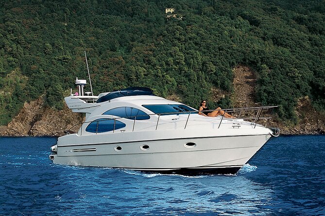 Santorini Caldera: Private Flybridge Yacht Experience - Red Beach in the morning light, your first swim and snorkel stop