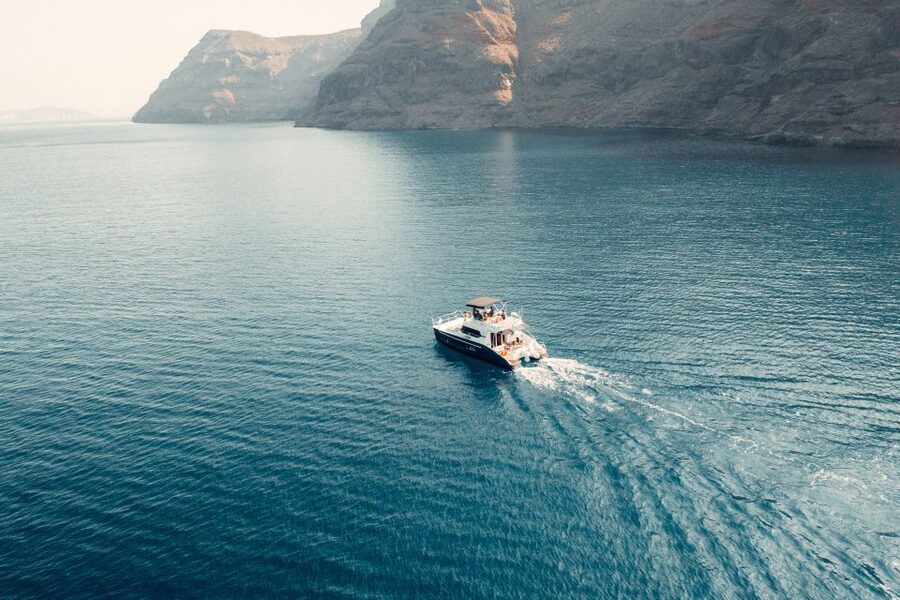 Santorini: Caldera Private Power Catamaran Cruise - Fira onboard BBQ and mezedes, a real meal not a snack