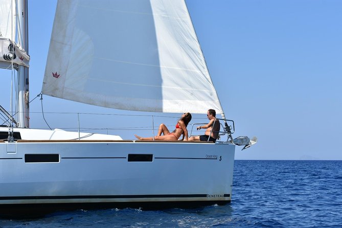 Santorini Caldera Private Sailing Boat Cruise - Red Beach stop: bright color, fast swim, easy fun