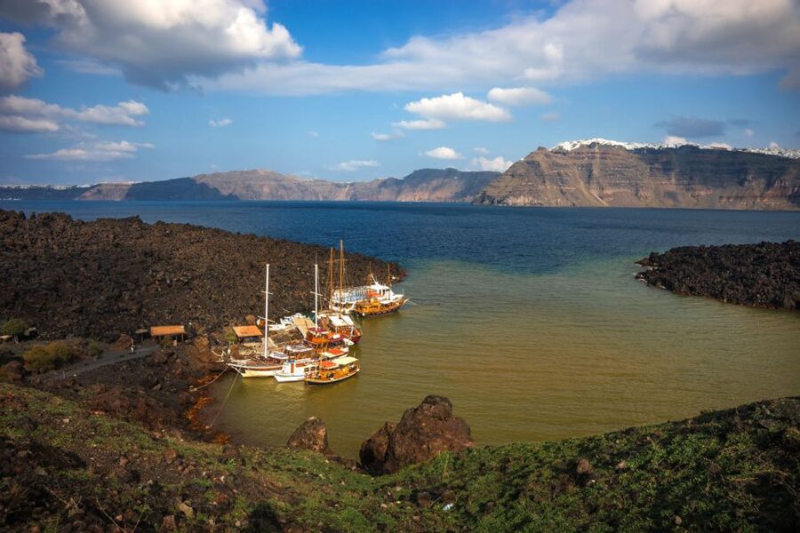 Santorini Caldera: Sunset Cruise with Dinner - From hotel pickup to Athinios Port: what the first 60 minutes look like
