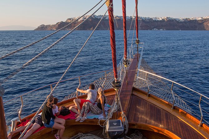Santorini Caldera Sunset Sailing Cruise with Dinner and Wine - Oia sunset from the caldera: the sea-level view is the whole trick