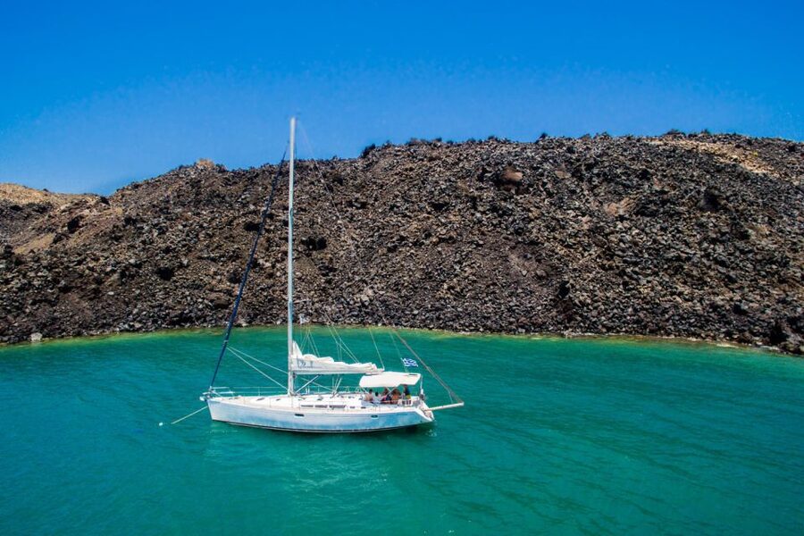 Santorini Caldera: Sunset Sailing Cruise with Meal - Mesa Pigadia Beach: Where the Swim and Snorkel Time Counts