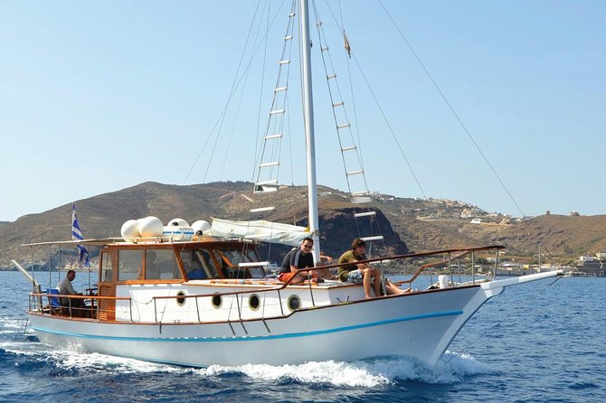 Santorini Caldera Sunset Traditional Cruise with Meal and Drinks - Akrotiri area lighthouse views: best “slow down” moment