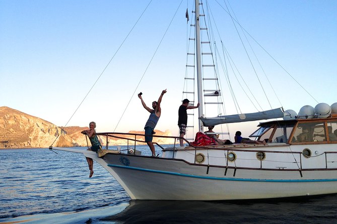 Santorini Caldera Sunset Traditional Cruise with Meal and Drinks - The small wood boat advantage (and the reality of getting bumpy water)