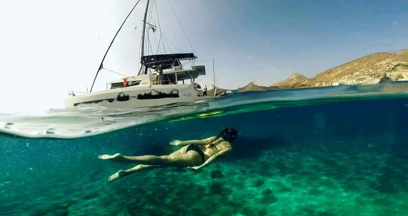 Santorini: Catamaran Cruise with Fresh Meal & Open Bar - Akrotiri Lighthouse and Black Mountain coves, where the swimming feels special