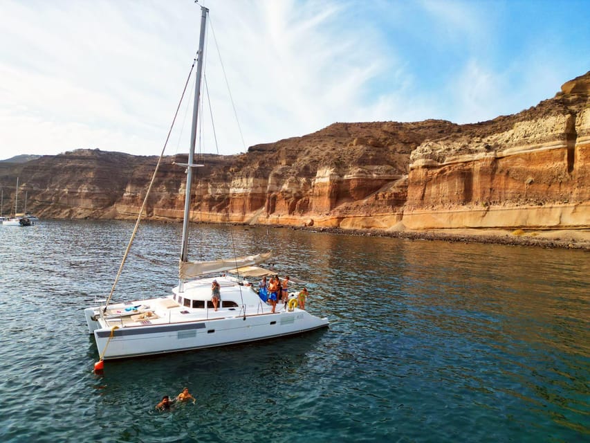 Santorini: Catamaran Cruise with Greek BBQ and Drinks - Setting sail from Vlychada Marina, then steering straight into fun