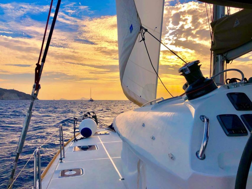 Santorini: Catamaran Cruise with Lunch, Drinks, & Oia Visit - Ammoudi Bay and the Caldera cliffs, with sea-level perspective