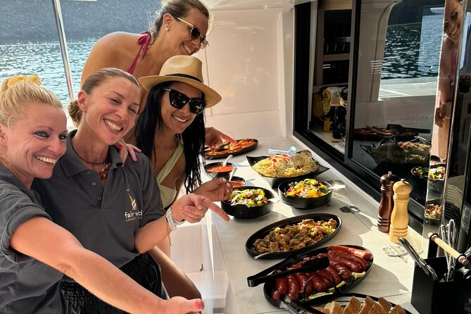 Santorini Catamaran Cruise with Meal and Drinks - From Vlychada Port to Red Beach’s Red Sands