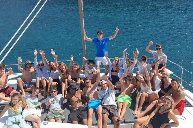 Santorini Catamaran Cruise with Meal and Drinks - Indian Rock, Sea Caves, and the Old Venetian Lighthouse Area