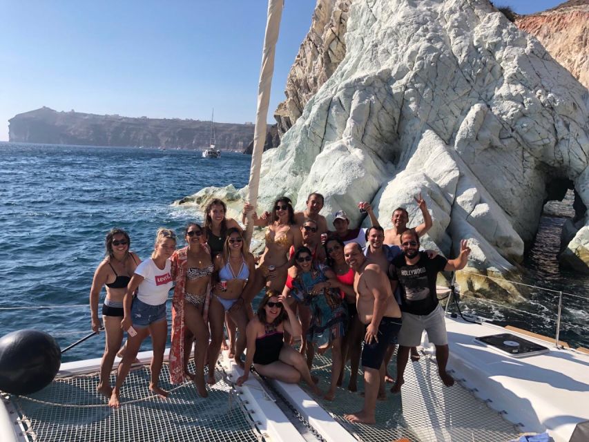 Santorini: Catamaran Cruise with Meal & Open Bar - Black Beach and Akrotiri lighthouse passes: short stops, good photos