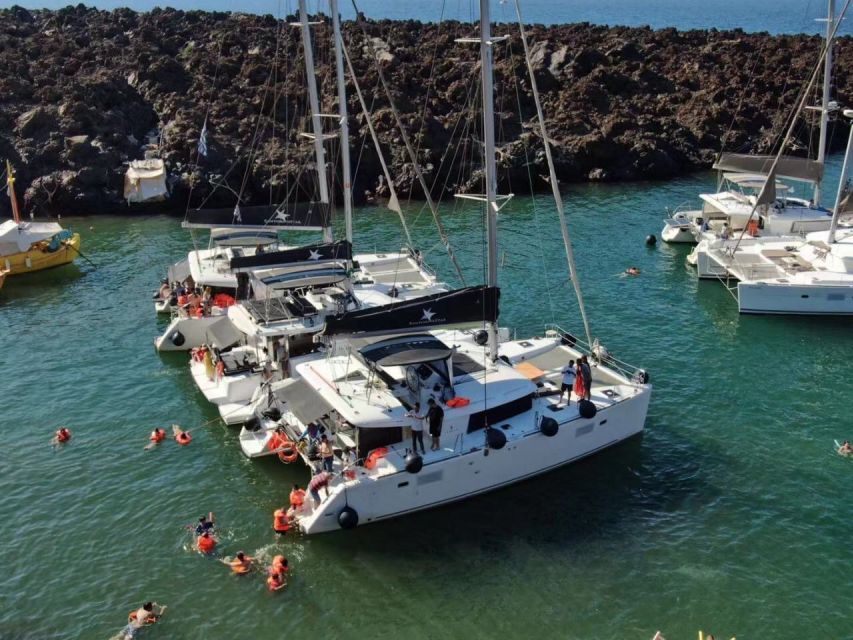 Santorini: Catamaran Cruise with Meal & Open Bar - Sailing past the volcano features toward Thirassia