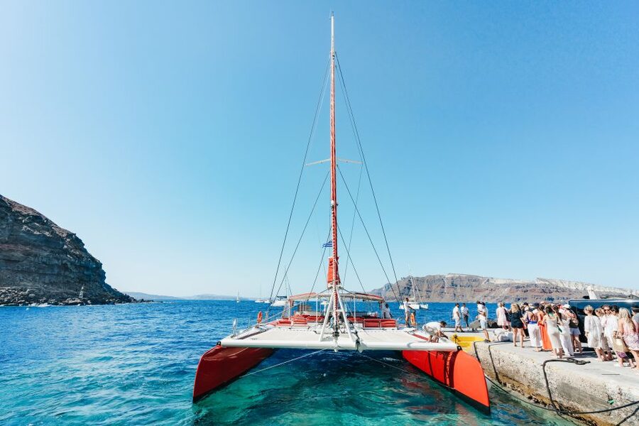 Santorini: Catamaran Tour with BBQ Dinner, Drinks, and Music - Stop 1: hot springs for a first swim