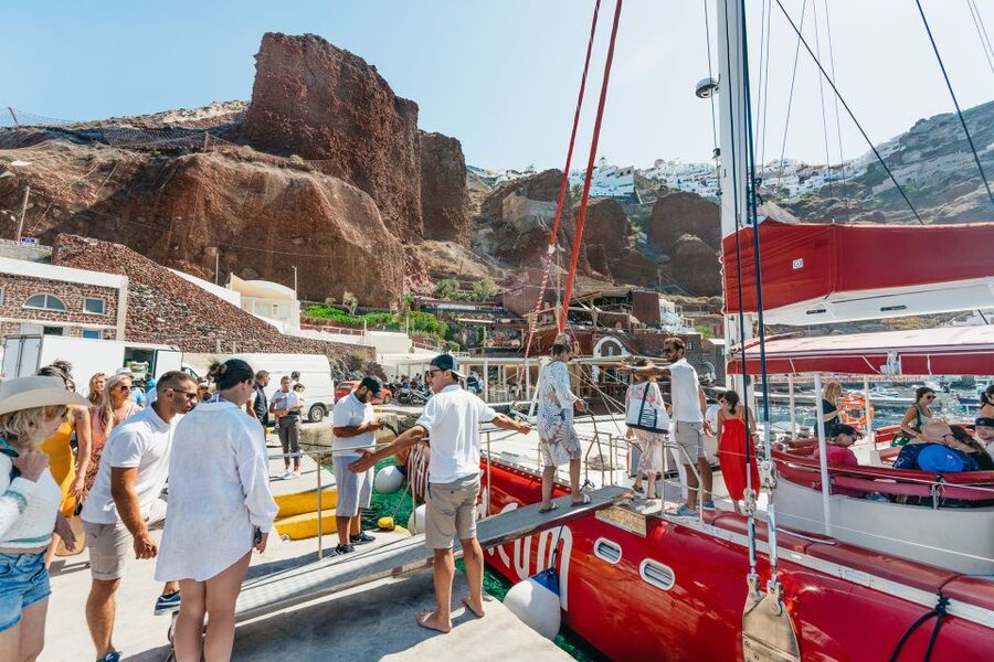 Santorini: Catamaran Tour with BBQ Dinner, Drinks, and Music - Stop 2: Red Beach area snorkeling and swimming