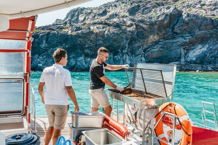 Santorini: Catamaran Tour with BBQ Dinner, Drinks, and Music - Stop 3: White Beach cliffs from the sea