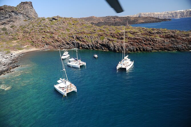 Santorini Classic Catamaran Cruise with BBQ, Drinks and Transfers - Sunset vs daytime: choose based on comfort and your tolerance for wind