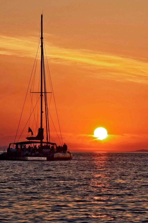 Santorini: Cruise Catamaran with BBQ & Drinks Day or Sunset - Red Beach: The Main Swim-and-Snorkel Stop for Big Color